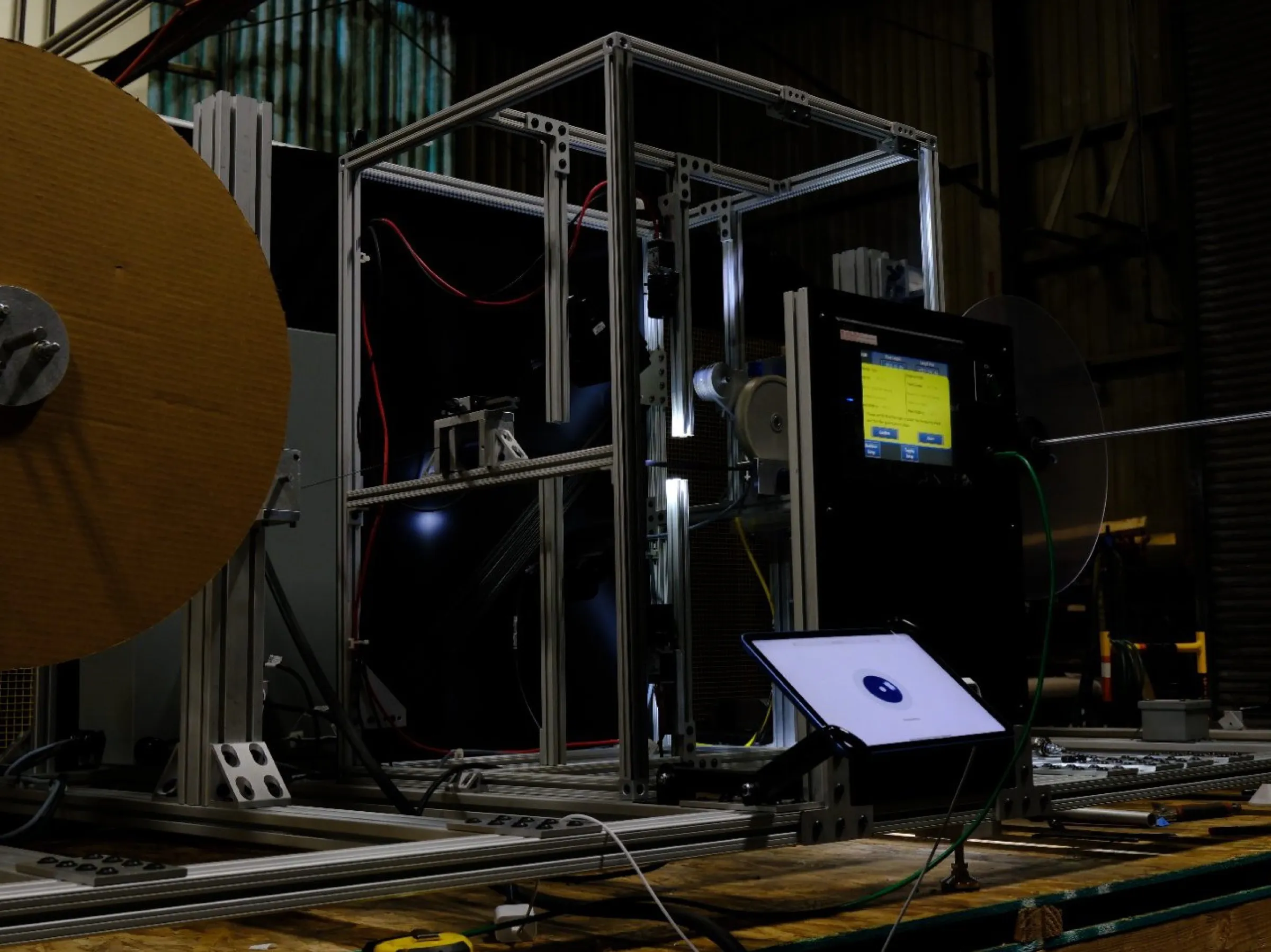 A Shelfmark off-line inspection machine scanning a roll of technical webbing